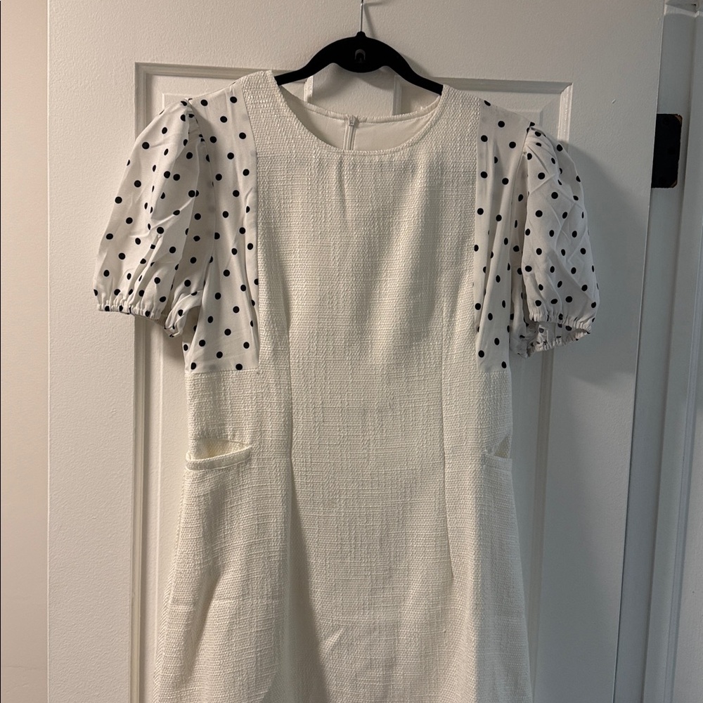 Elegant White Dress with Polka Dot Sleeves